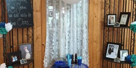 Wedding gift table with decorative backdrop display.