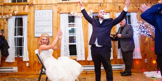 Bride and groom celebrating at wedding reception.