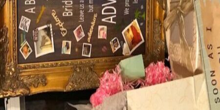 Wedding bucket list board with photos.